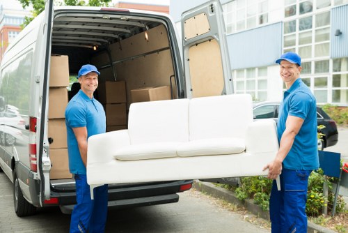 Team members reviewing ethical labour standards at Removal Company Soho