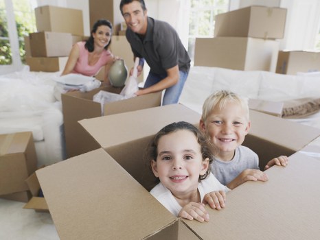 Office relocation team planning a move in Soho with boxes and desks