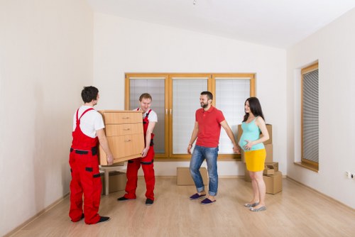 Removal team handling a move in Soho street setting