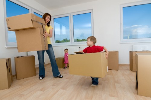 Packed boxes and furniture prepared for a student move in Soho
