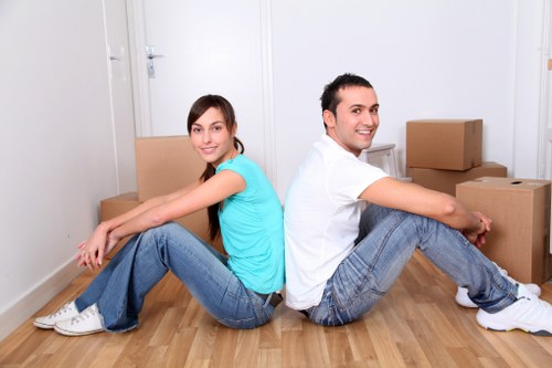Removal specialists using safe lifting equipment
