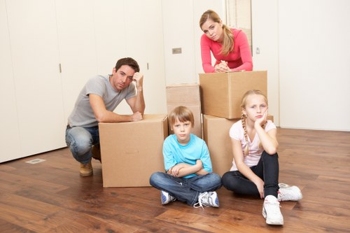 Careful placement of boxes and furniture during unpacking in Soho
