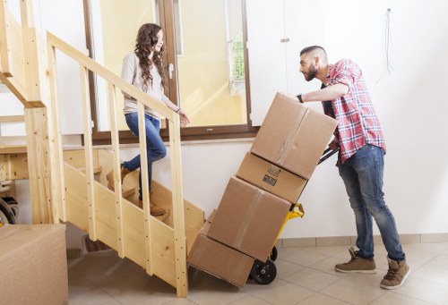 Packed office furniture and equipment ready for relocation in central London
