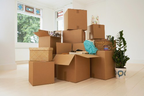 Packing and loading belongings for a Soho residential move in a compact apartment setting