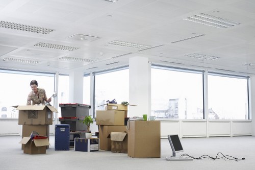 Boxes and furniture prepared for a flat move in Soho
