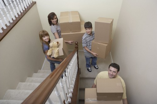 Professional movers loading office equipment in central London